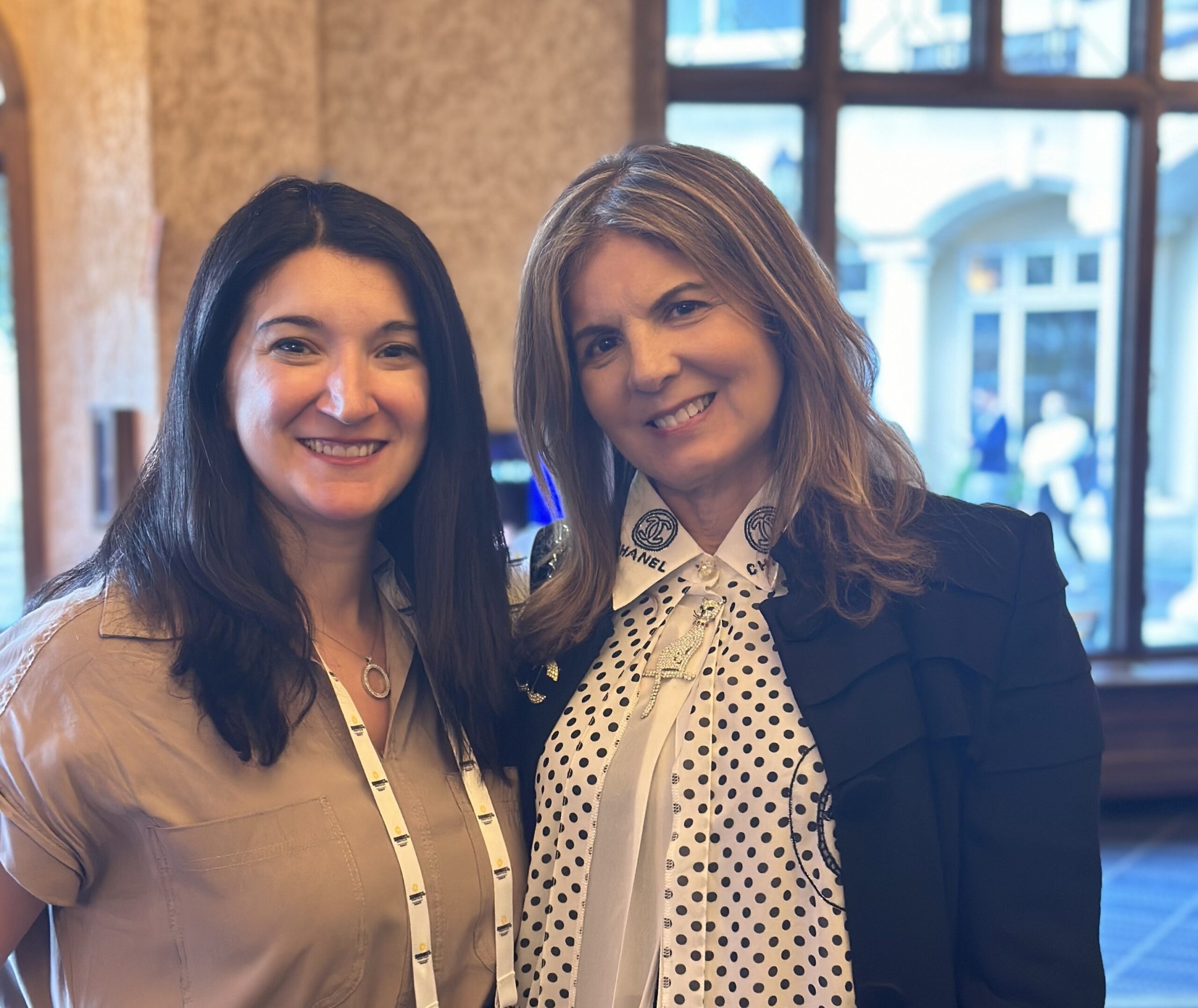 Two women - Sholeh Alemi Fabbri and Nora Felder - smiling and posing together